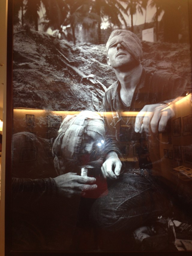 A picture of a US medic that is wounded, yet still vigorously helping his comrades. 